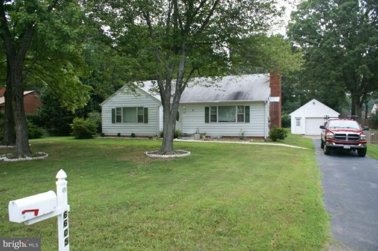 6605 Greenleaf Street Springfield, VA 22150 - Photo 1 of 10 a front view of a house with garden