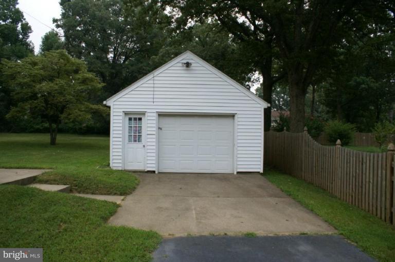 6605 Greenleaf Street Springfield, VA 22150 - Photo 2 of 10 a front view of a house with a garden and yard
