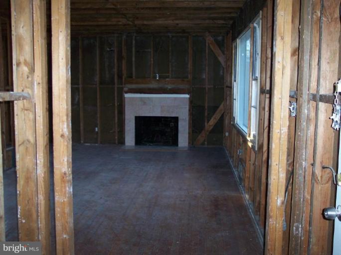 6605 Greenleaf Street Springfield, VA 22150 - Photo 4 of 10 a view of a livingroom with a fireplace