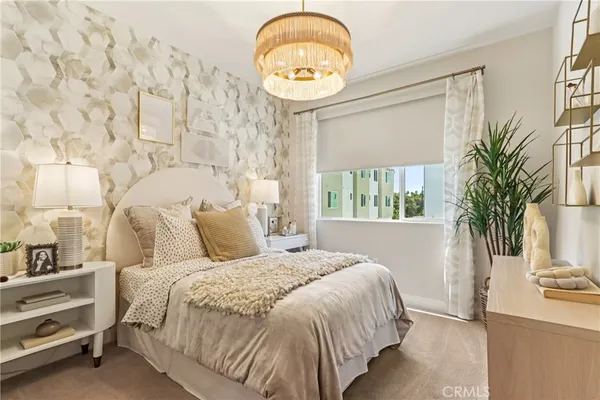 a bedroom with a large bed and a large window