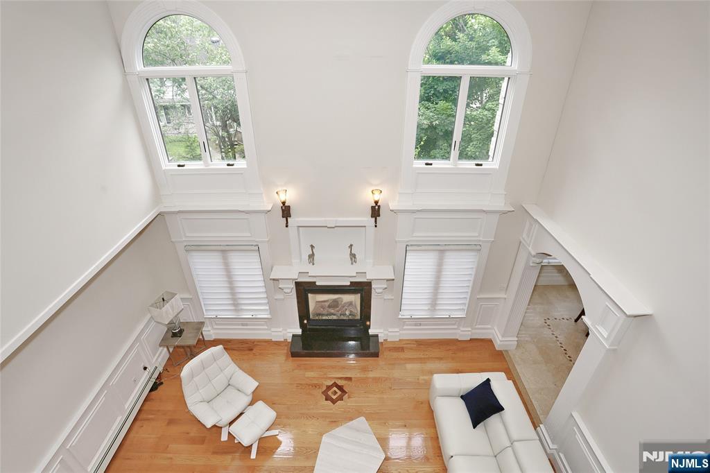 65 Ross Avenue Demarest, NJ 07627 - Photo 16 of 48 a living room with furniture and a fireplace