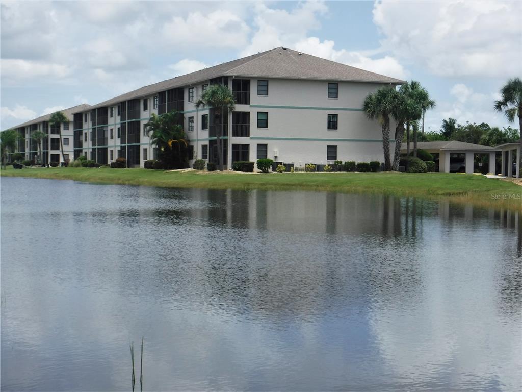 175 Kings Highway, Unit 1022 Punta Gorda, FL 33983 - Photo 1 of 1 a view of a house with a yard and sitting area