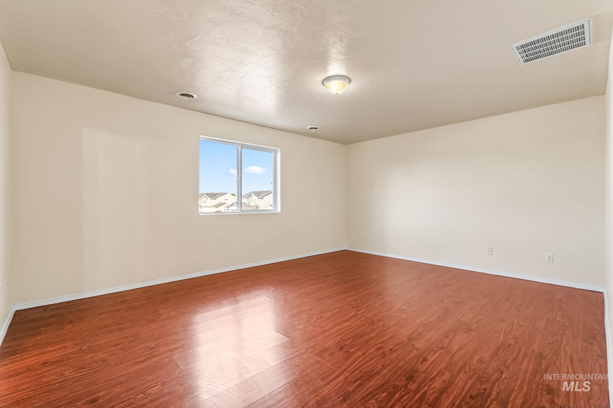 4523 Duke Street Caldwell, ID 83607 - Photo 16 of 27 Empty room with wood finished floors