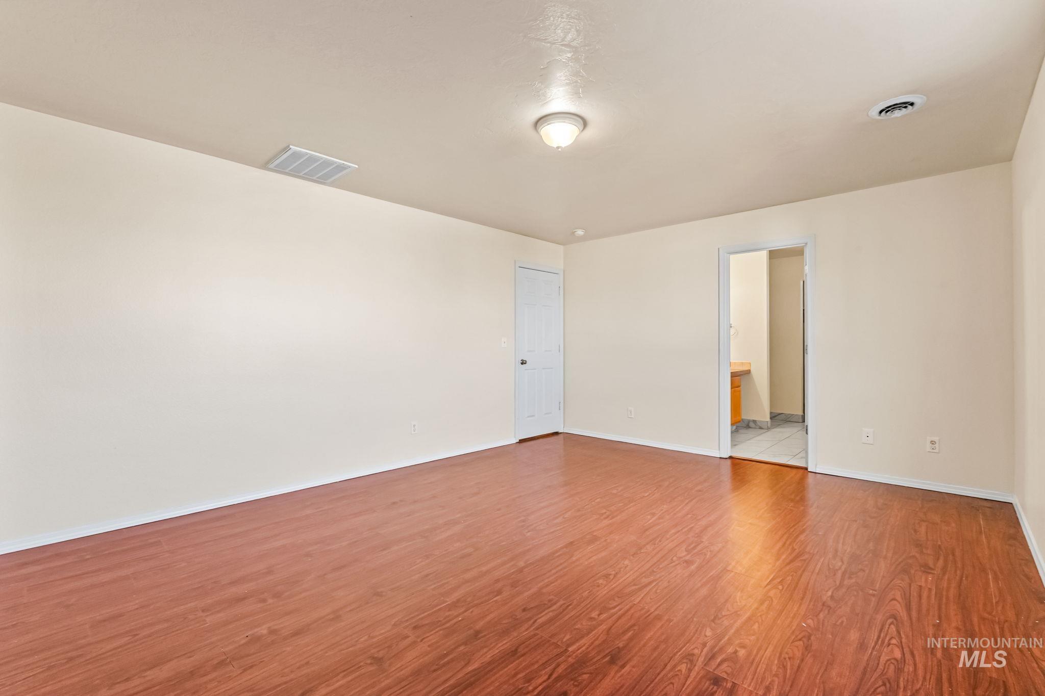 4523 Duke Street Caldwell, ID 83607 - Photo 17 of 27 Empty room with light wood-style flooring and baseboards