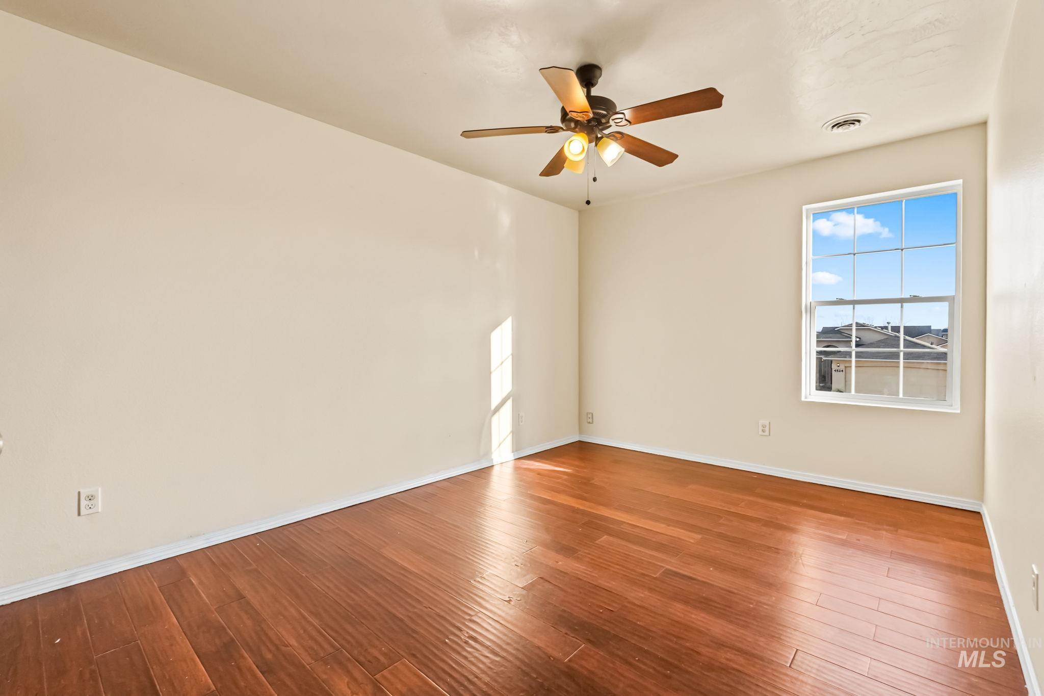 4523 Duke Street Caldwell, ID 83607 - Photo 21 of 27 Spare room featuring hardwood / wood-style floors and a ceiling fan