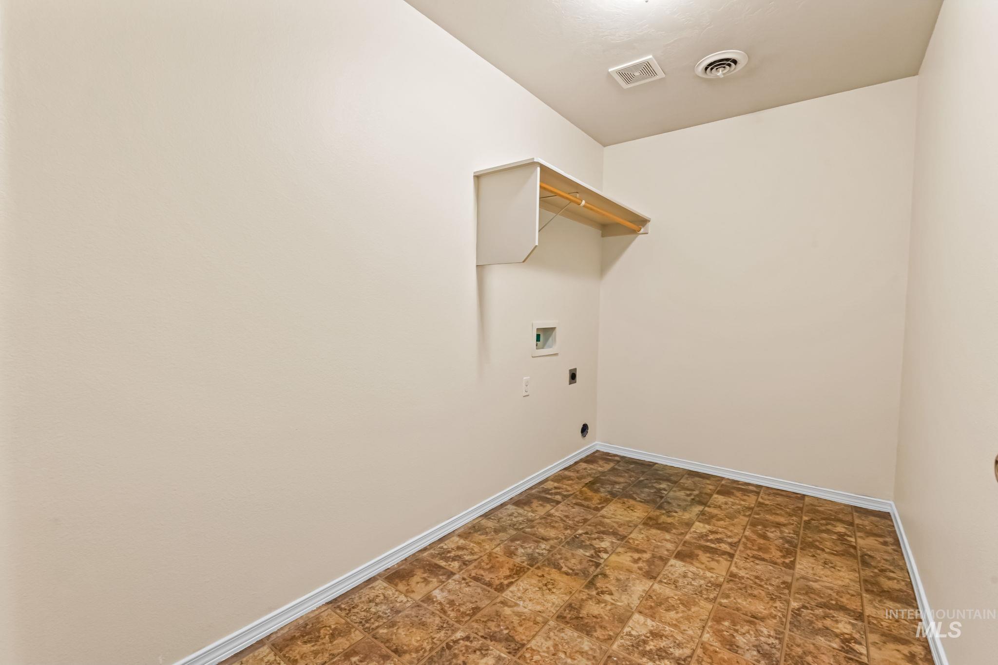 4523 Duke Street Caldwell, ID 83607 - Photo 24 of 27 Laundry area featuring hookup for a washing machine, hookup for an electric dryer, and stone finish flooring