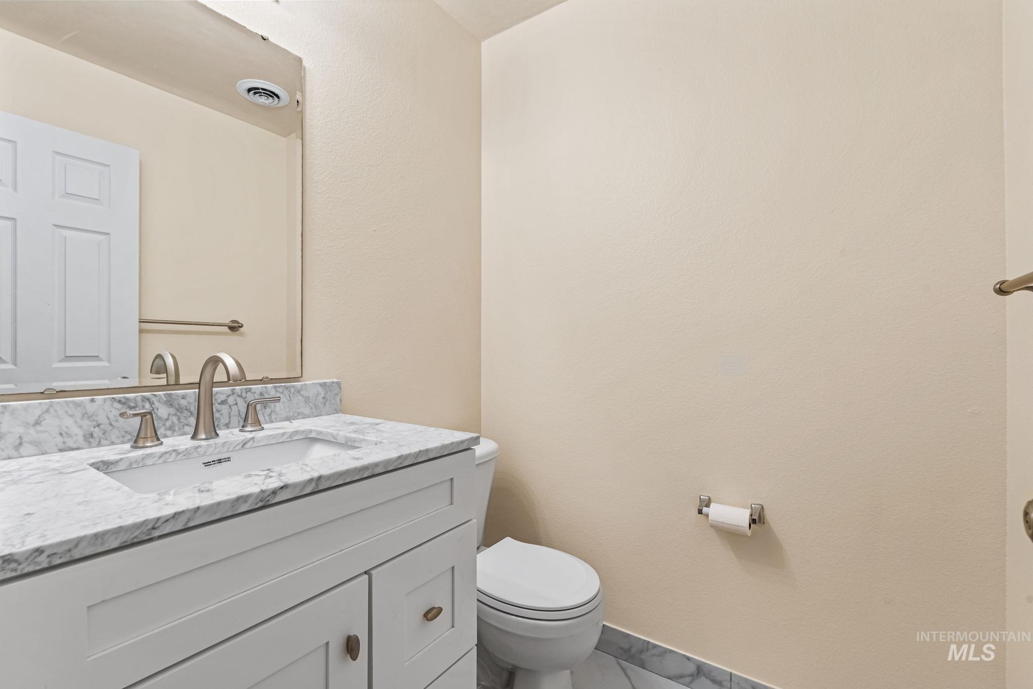 4523 Duke Street Caldwell, ID 83607 - Photo 6 of 27 Bathroom with vanity and marble finish floors