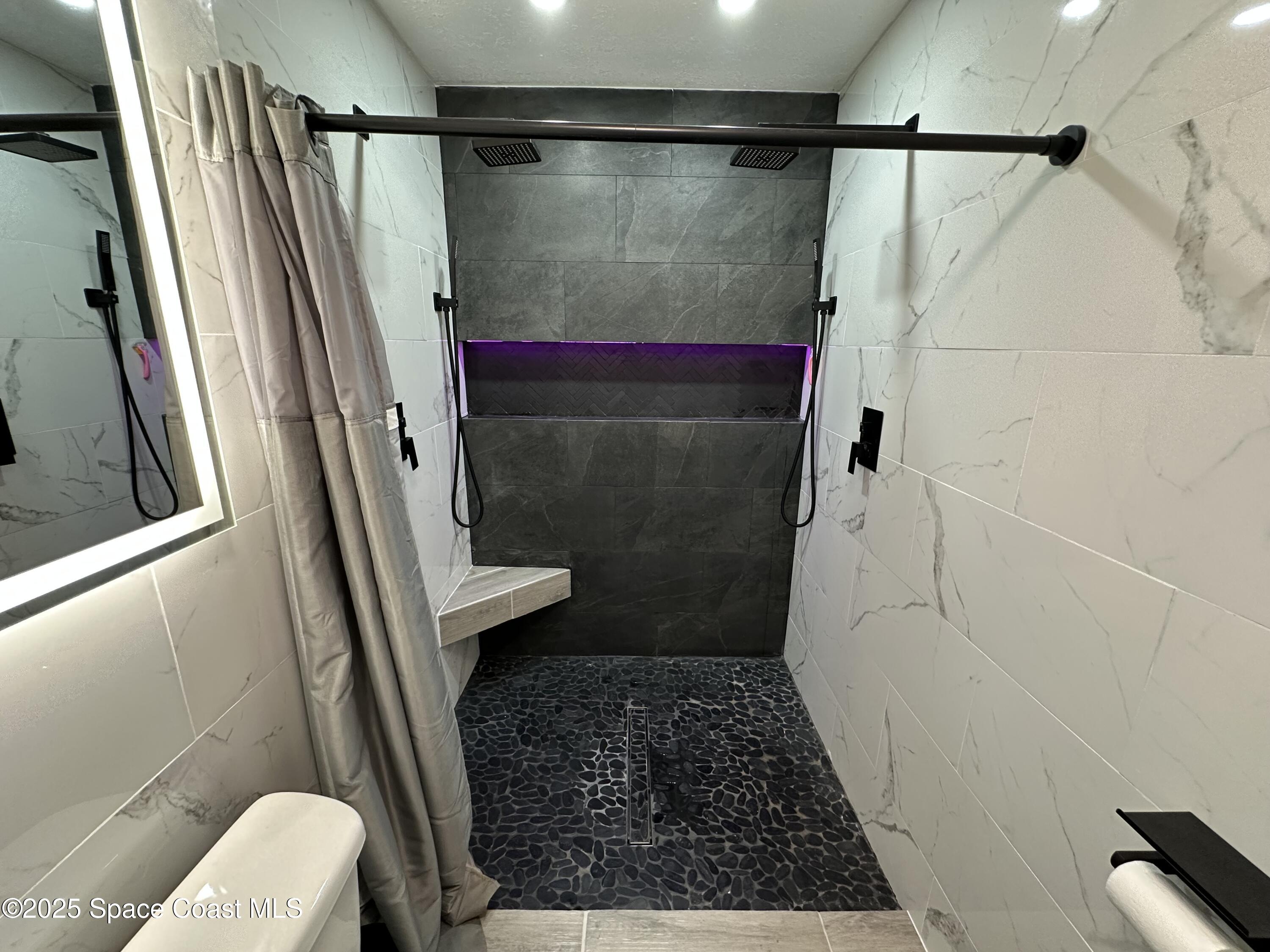 3782 Catalina Drive Cocoa, FL 32926 - Photo 15 of 17 a bathroom with a shower and a toilet