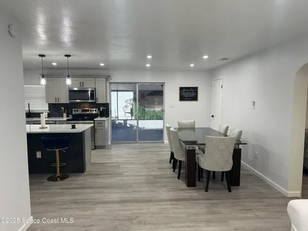 a kitchen with a table and chairs in it