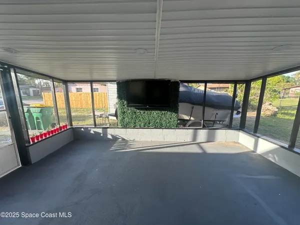 a view of an empty room with a sliding door