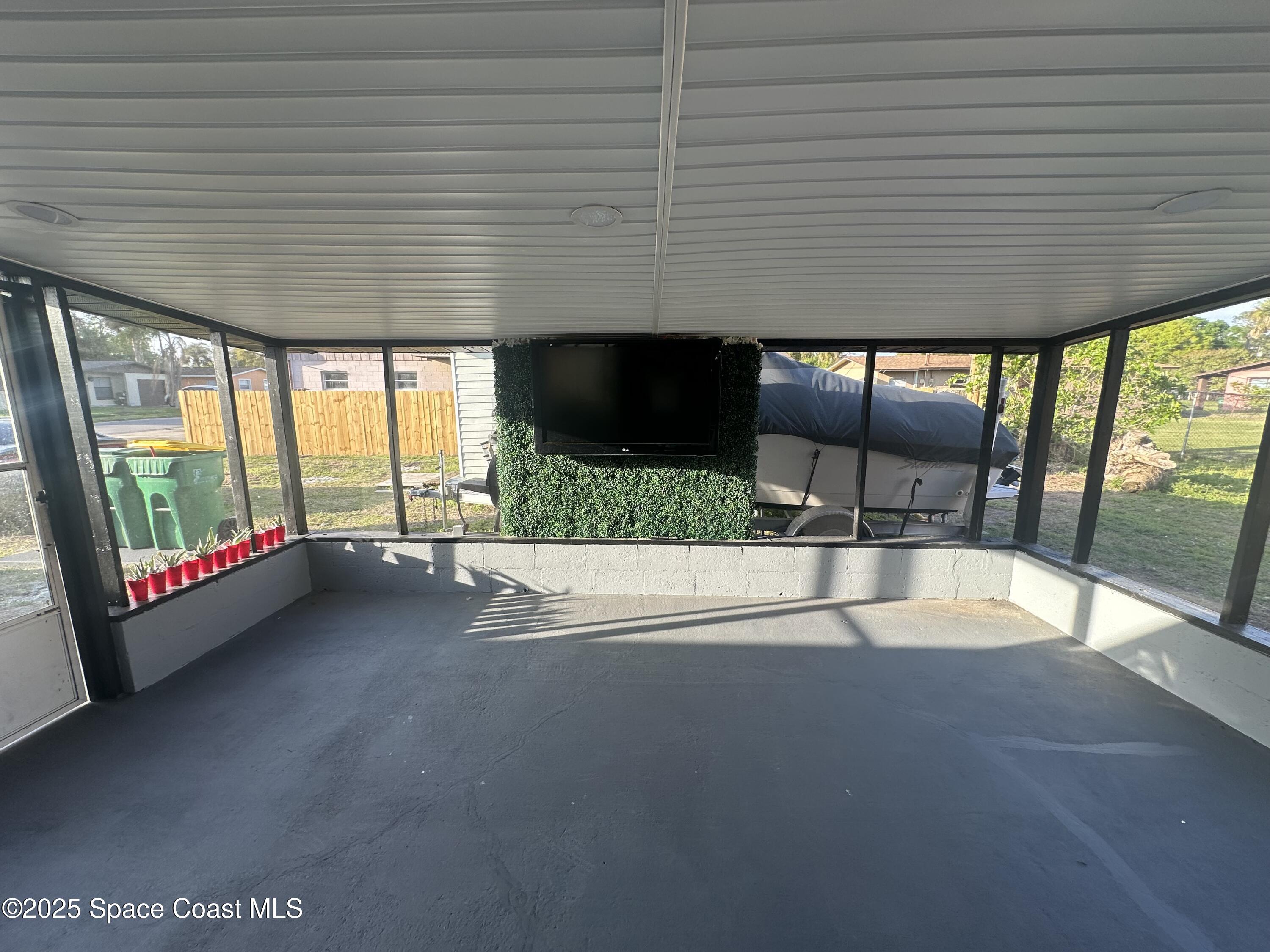 3782 Catalina Drive Cocoa, FL 32926 - Photo 9 of 17 a view of an empty room with a sliding door