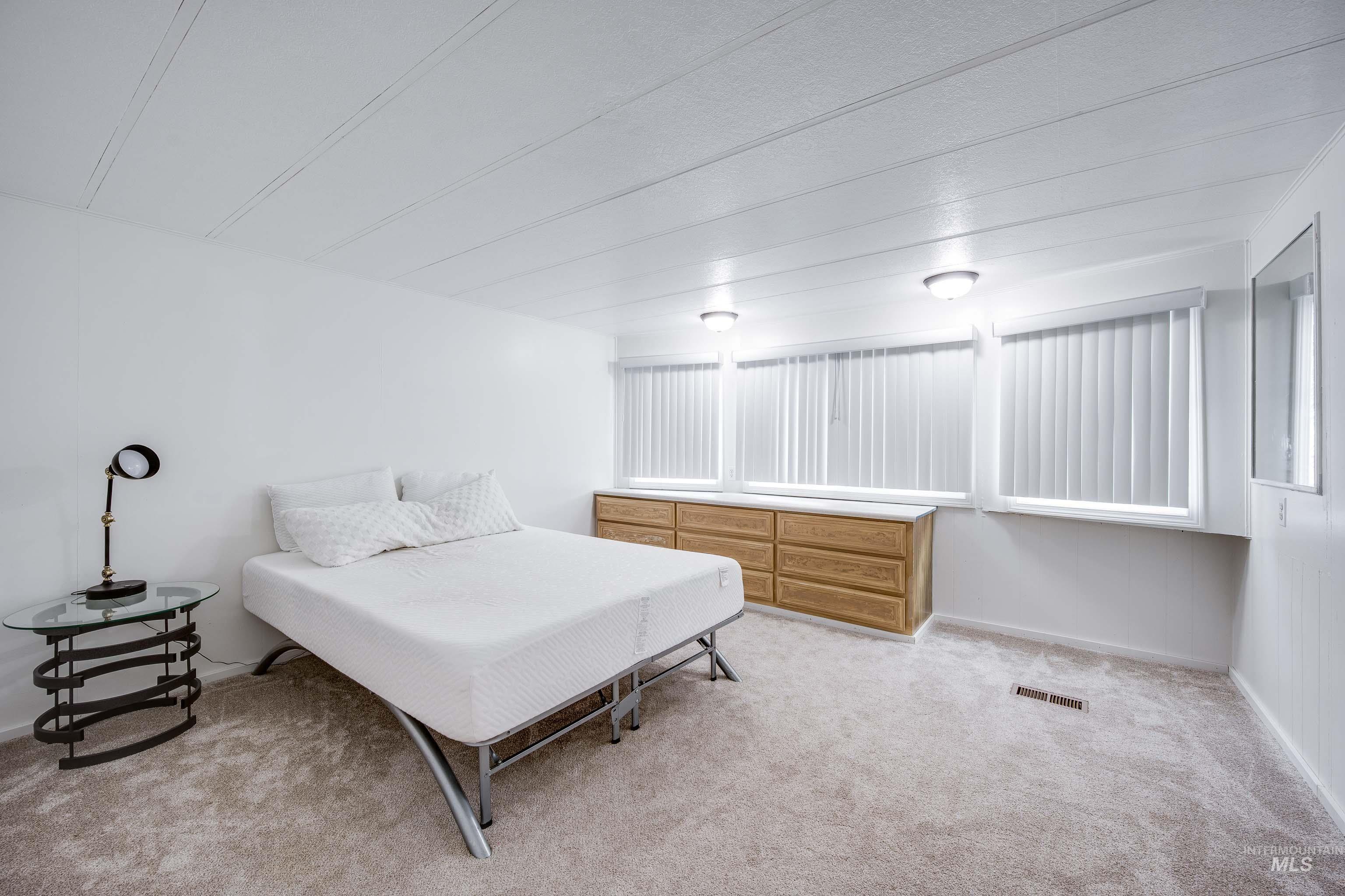 411 North Almon Street, Unit 304 Moscow, ID 83843 - Photo 11 of 21 Bedroom featuring light colored carpet and baseboards