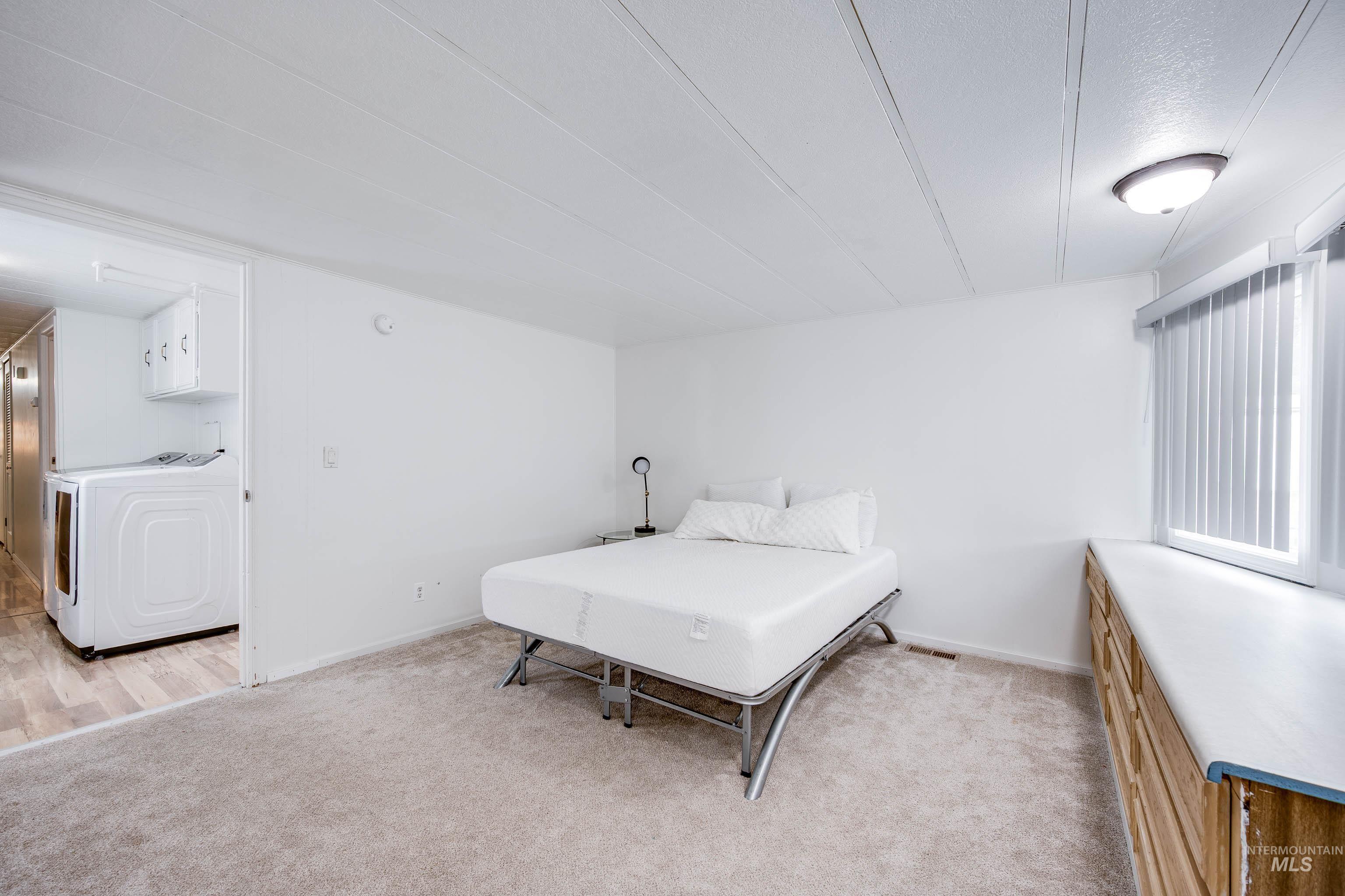 411 North Almon Street, Unit 304 Moscow, ID 83843 - Photo 12 of 21 Bedroom with light carpet