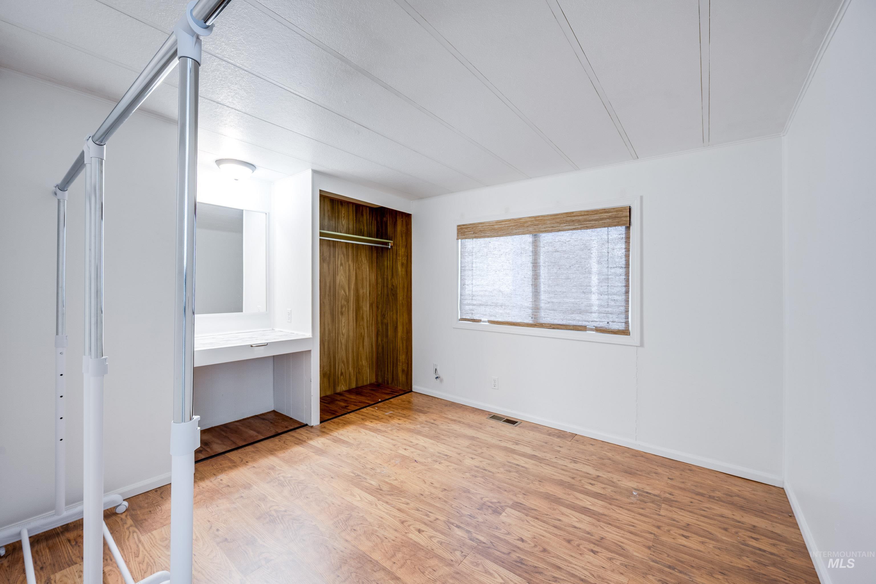 411 North Almon Street, Unit 304 Moscow, ID 83843 - Photo 14 of 21 Unfurnished bedroom featuring light wood-style flooring and baseboards