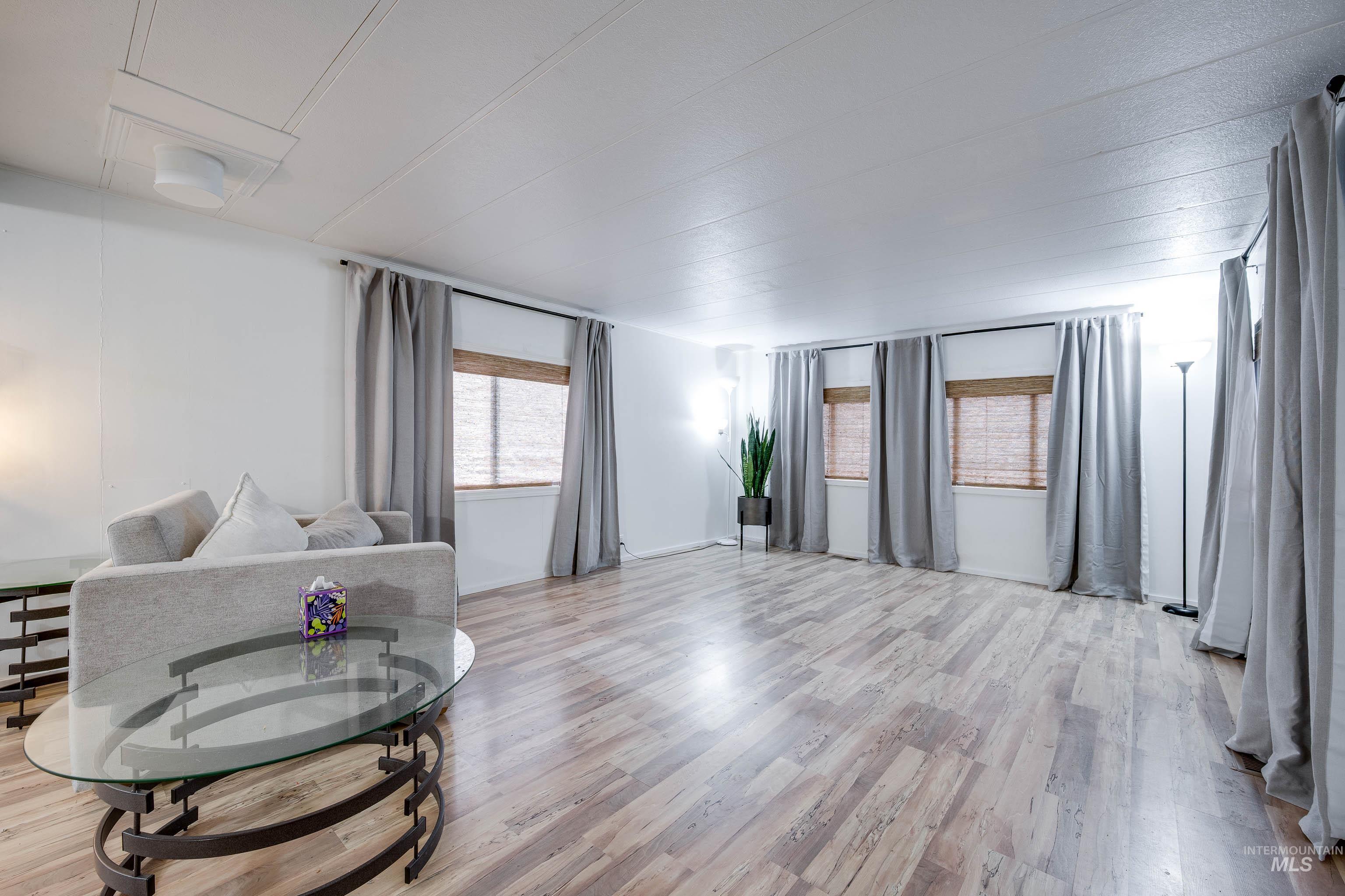 411 North Almon Street, Unit 304 Moscow, ID 83843 - Photo 7 of 21 Living room featuring light wood finished floors