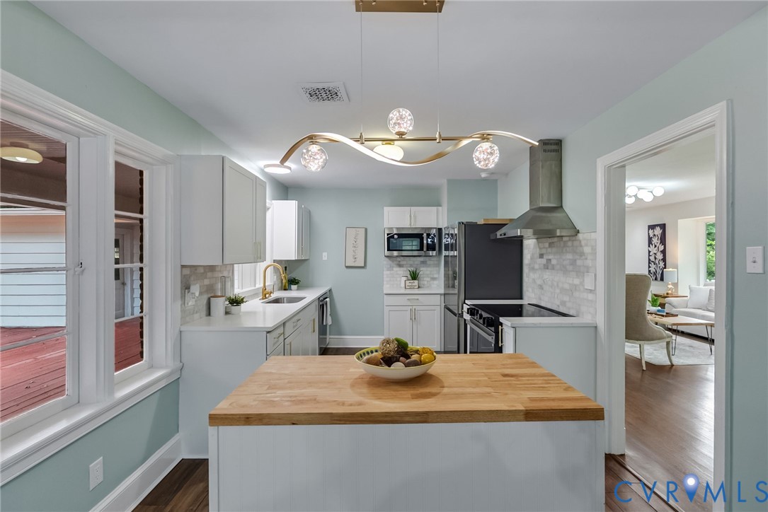 1136 Overbrook Road Petersburg, VA 23805 - Photo 18 of 51 Kitchen featuring a central island with a wood cou