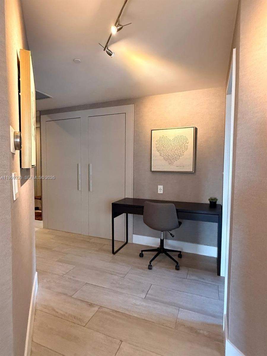 45 Southwest 9th Street, Unit 1401 Miami, FL 33130 - Photo 7 of 17 a workspace with furniture and window