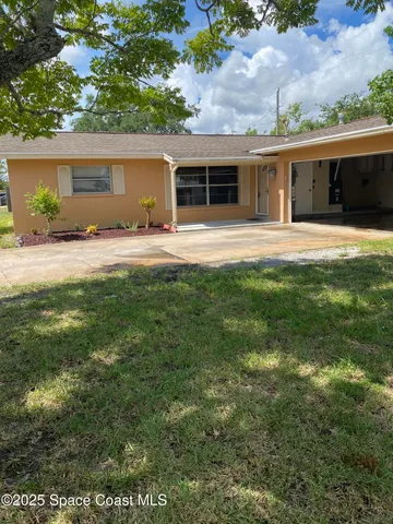 a house view with a garden space