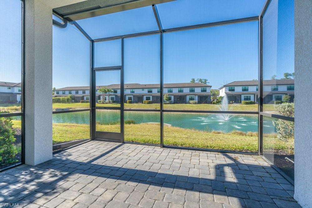 7565 Carnegie Way Naples, FL 34119 - Photo 25 of 50 Unfurnished sunroom featuring a water view