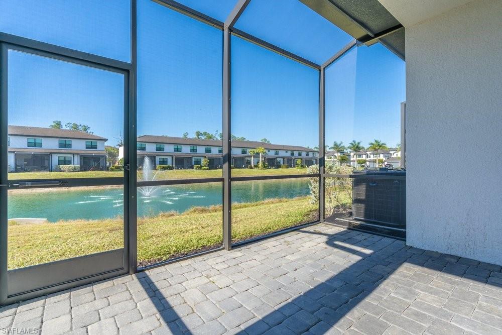 7565 Carnegie Way Naples, FL 34119 - Photo 26 of 50 Unfurnished sunroom featuring a water view
