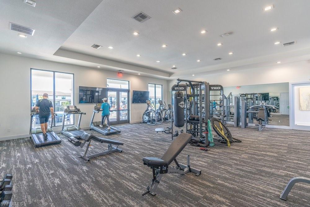 7565 Carnegie Way Naples, FL 34119 - Photo 46 of 50 Exercise room featuring french doors and recessed lighting