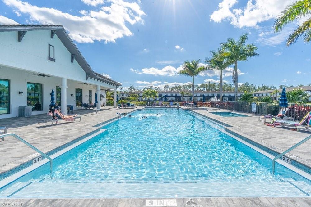 7565 Carnegie Way Naples, FL 34119 - Photo 47 of 50 Community pool with a patio area