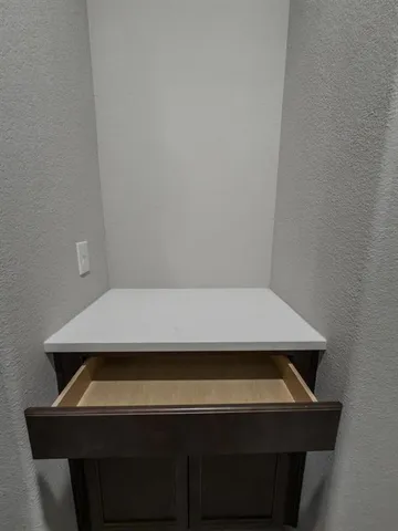 a white bath tub sitting next to a white toilet