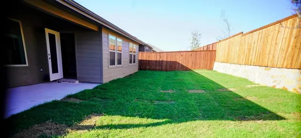 a view of a backyard with garden