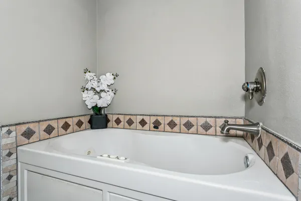 a bathroom with a bathtub and shower