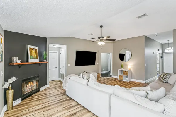 a living room with furniture and a flat screen tv