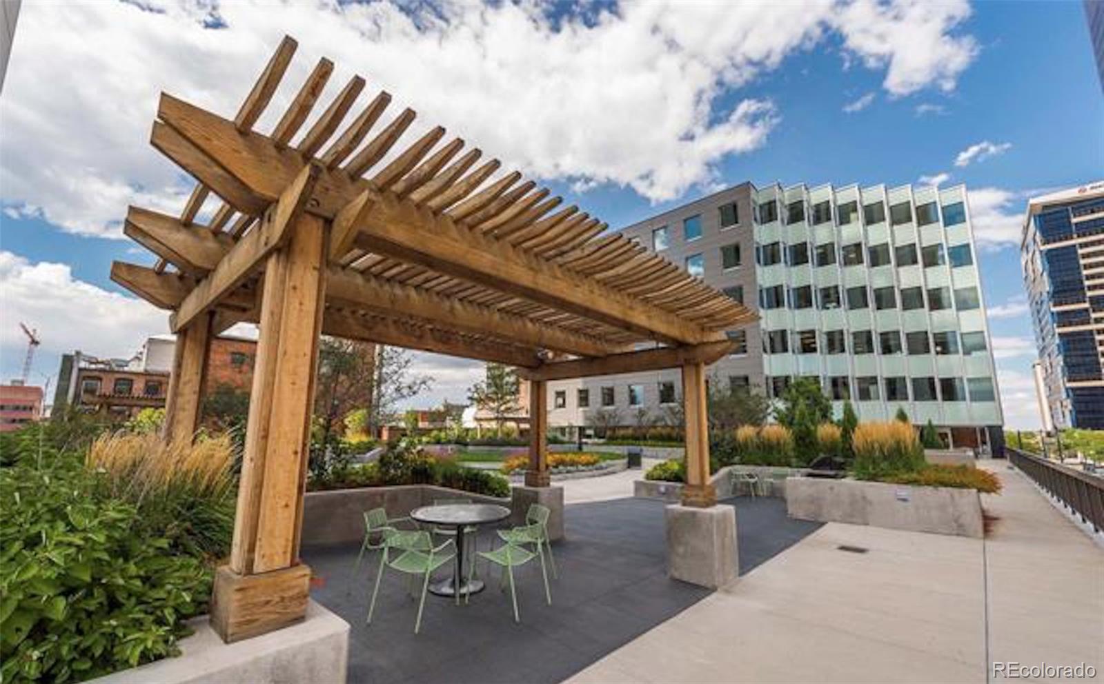 1625 Larimer Street, Unit 3104 Denver, CO 80202 - Photo 27 of 31 a building outdoor space with patio furniture and potted plants