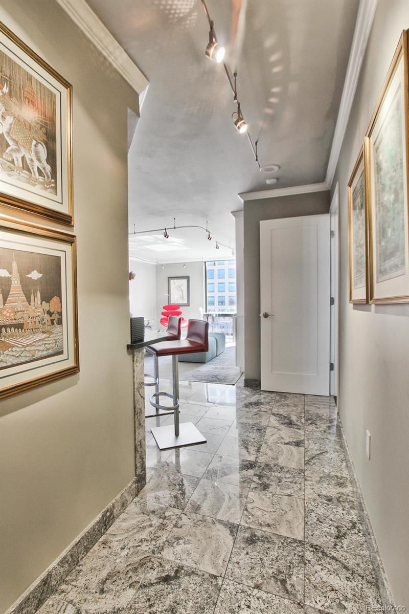 1625 Larimer Street, Unit 3104 Denver, CO 80202 - Photo 4 of 31 a view of a hallway with seating area