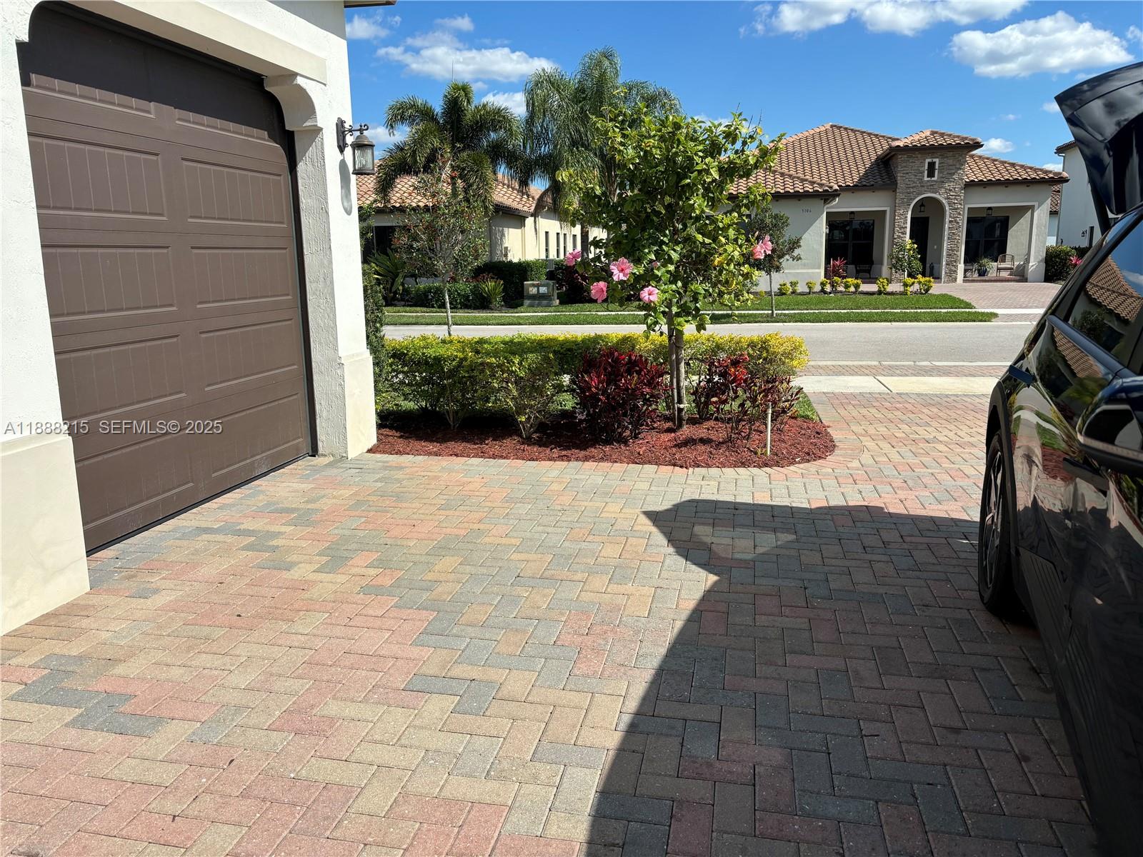 5107 Genoa Street, Unit 5107 Ave Maria, FL 34142 - Photo 11 of 16 a view of house with yard outdoor seating and entertaining space