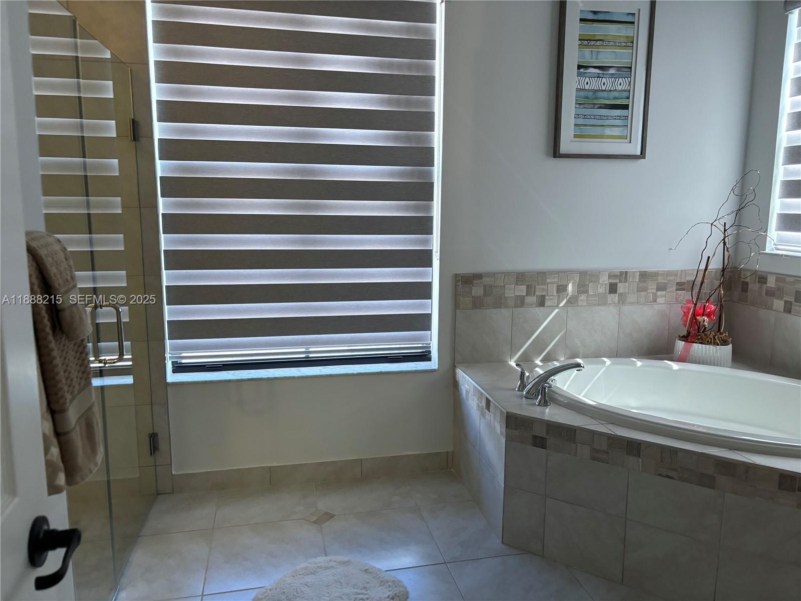 5107 Genoa Street, Unit 5107 Ave Maria, FL 34142 - Photo 16 of 16 a bathroom with a sink and a mirror