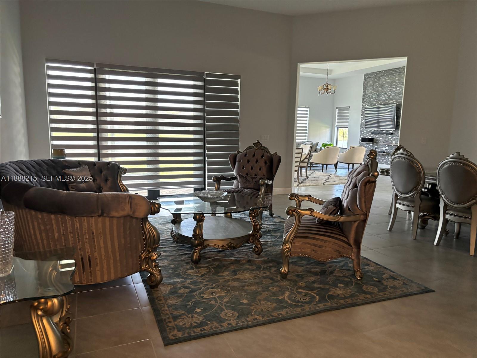 5107 Genoa Street, Unit 5107 Ave Maria, FL 34142 - Photo 2 of 16 a living room with furniture and a window
