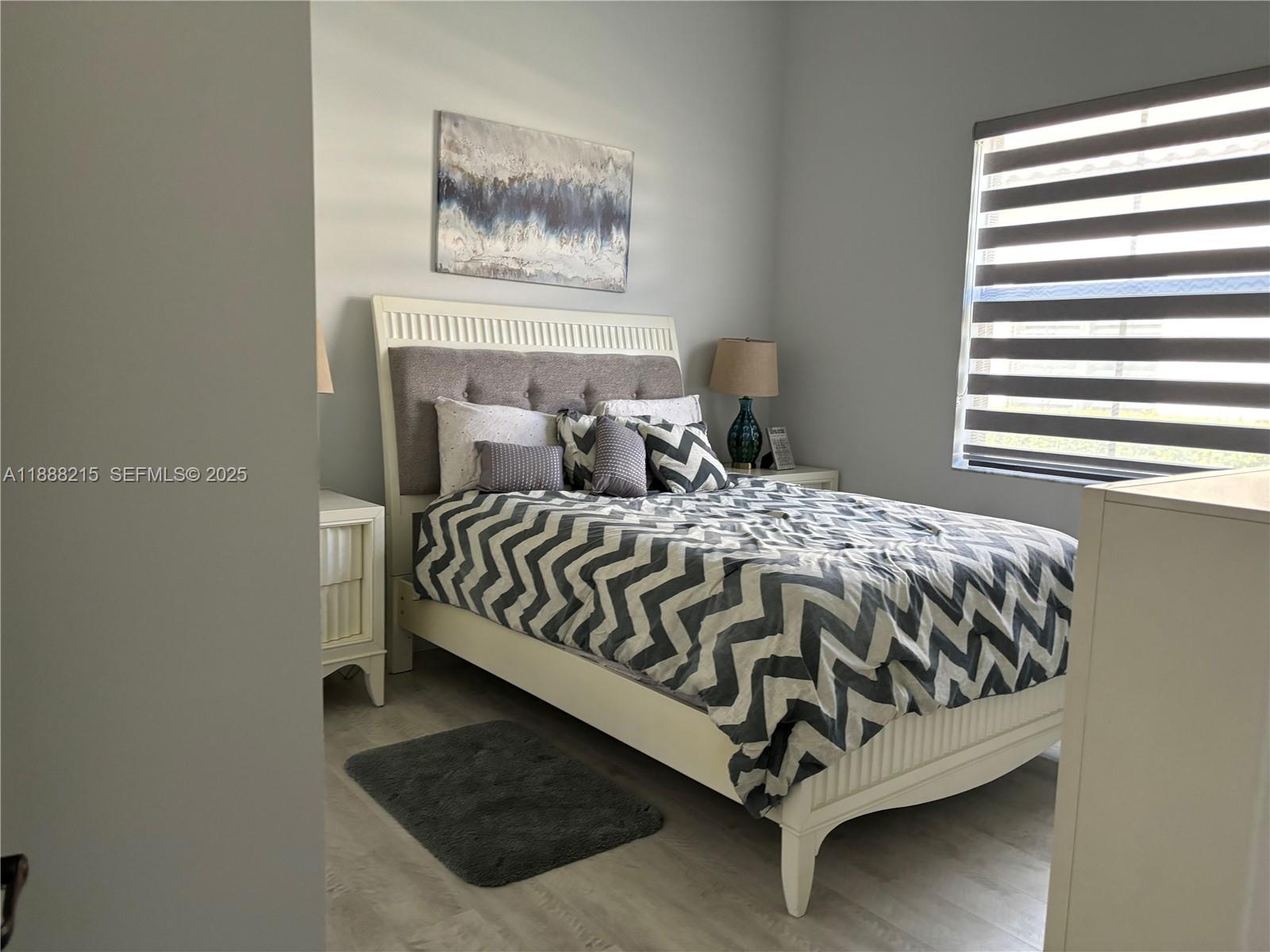 5107 Genoa Street, Unit 5107 Ave Maria, FL 34142 - Photo 9 of 16 a bedroom with a bed and window