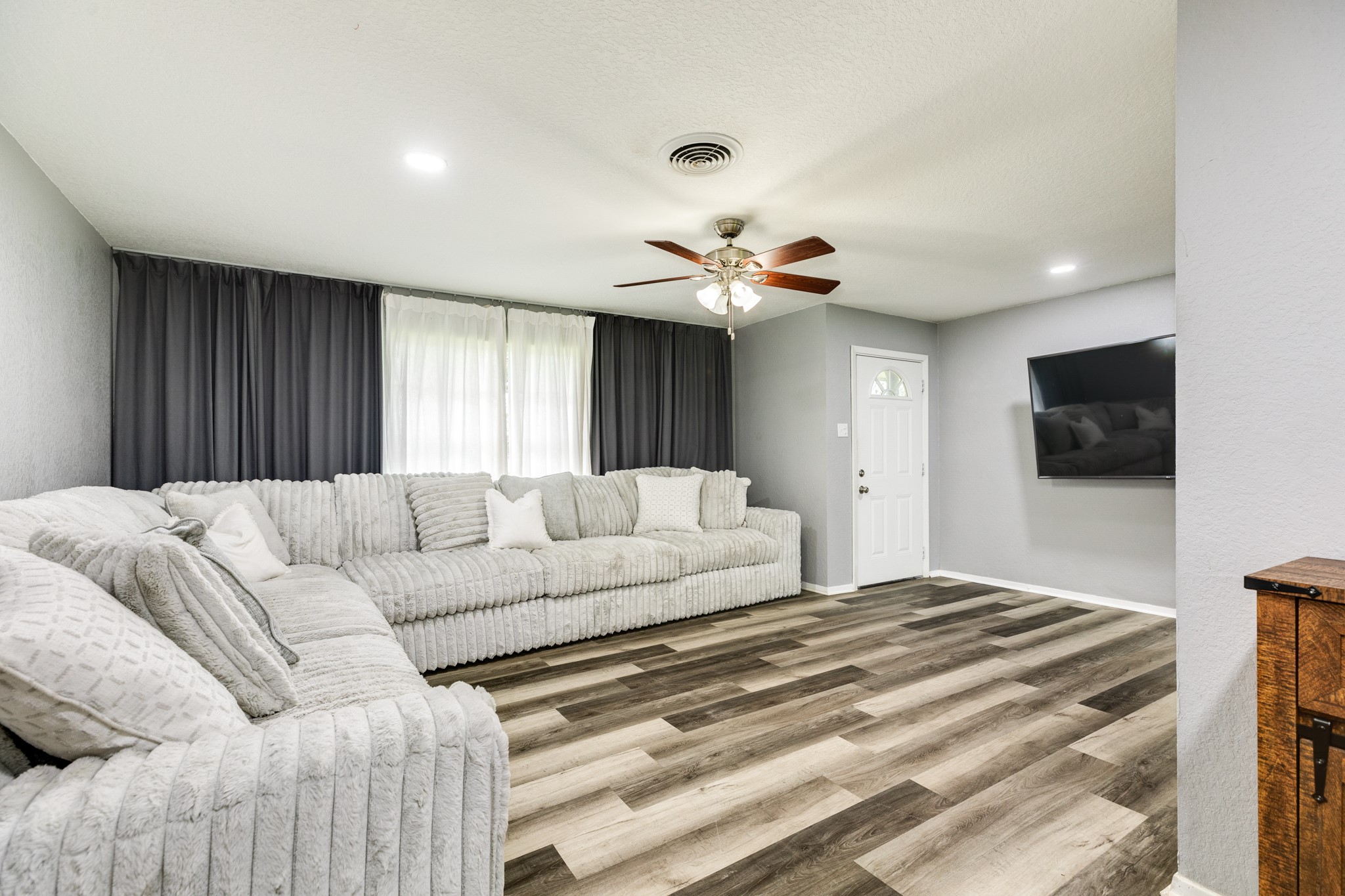 908 West Mulberry Street Angleton, TX 77515 - Photo 6 of 22 a living room with a couch and a flat screen tv