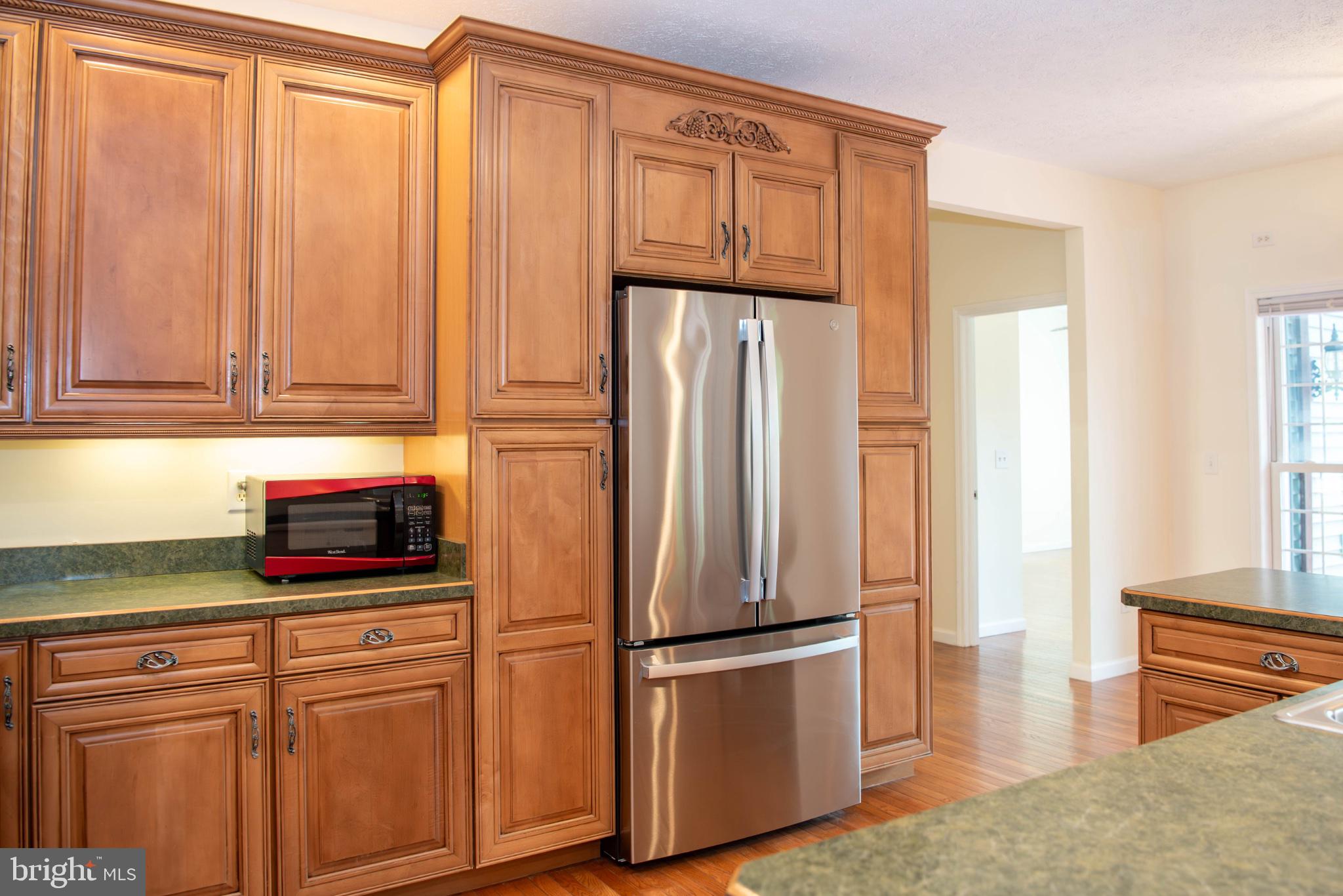 792 Forest Glen Road Moorefield, WV 26836 - Photo 43 of 146 Modern kitchen with rich cabinetry.