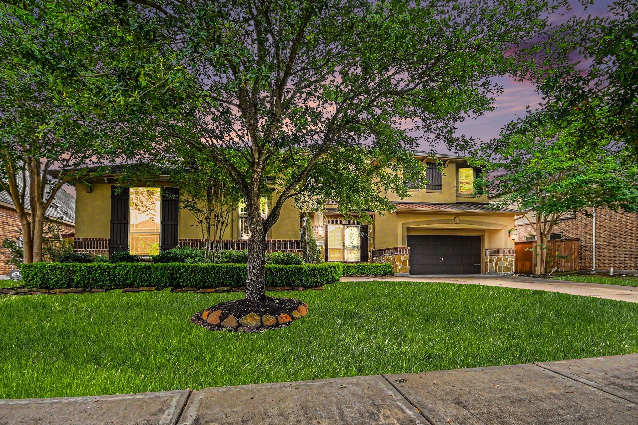 a front view of a house with garden