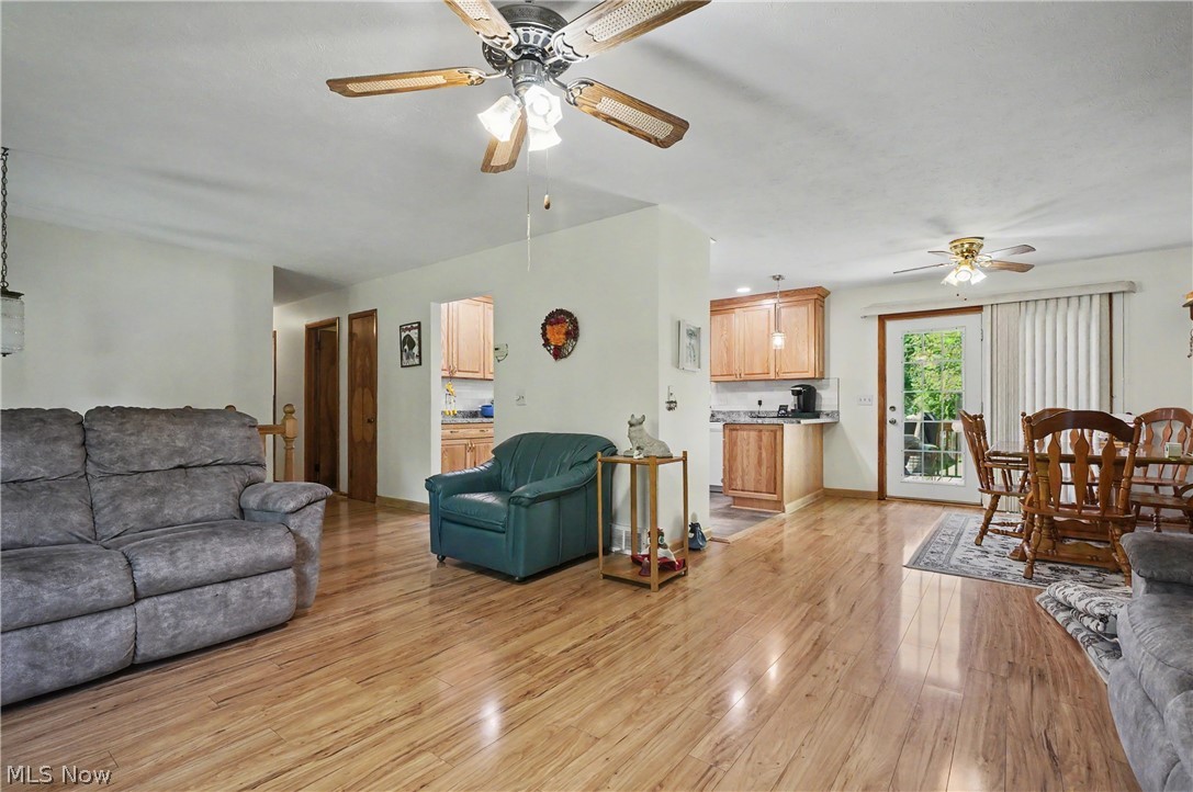 4250 Herr Fieldhouse Road Southington, OH 44470 - Photo 6 of 50 Expansive open-concept living space with wood-finish flooring