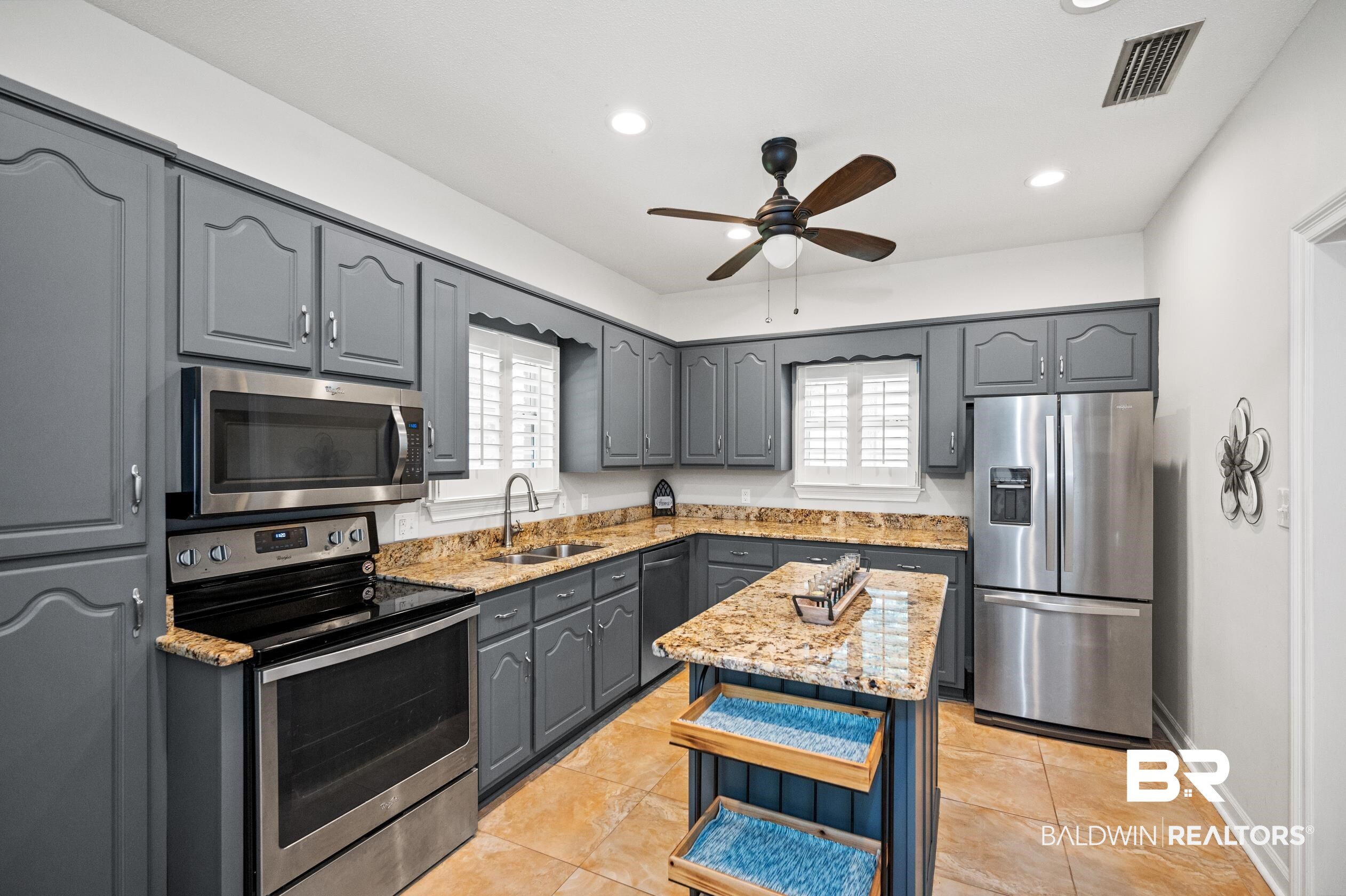 6638 Jackson Square Daphne, AL 36526 - Photo 4 of 62 Kitchen featuring gray cabinets, stainless steel appliances, a kitchen island, and ceiling fan