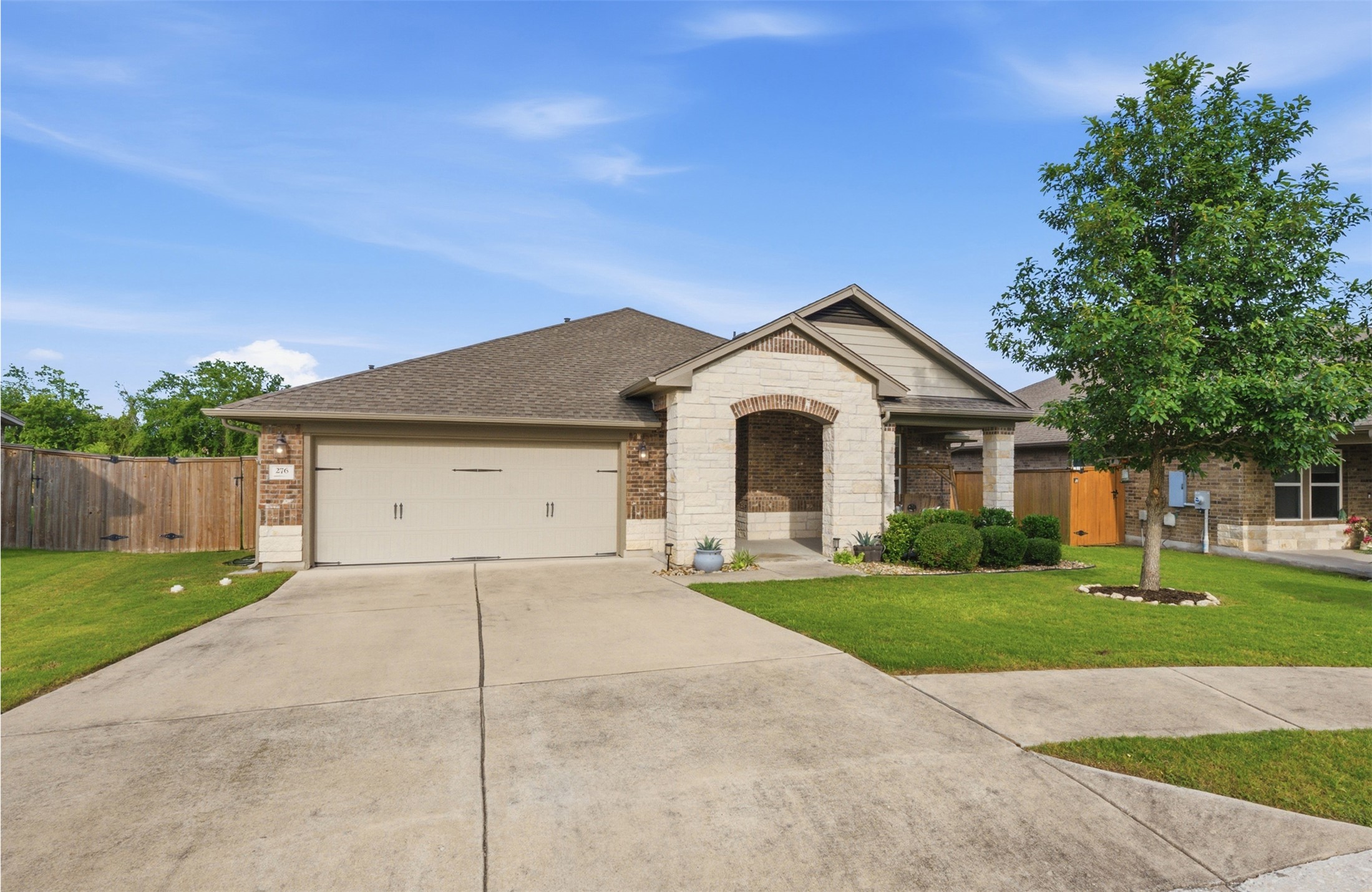 276 Gunnison Way Kyle, TX 78640 - Photo 15 of 28 a front view of a house with a yard and garage
