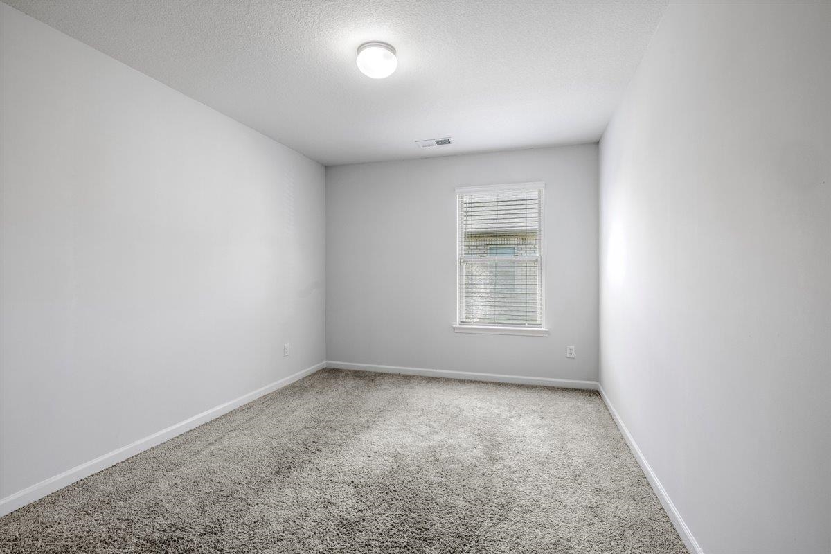 5320 Crossfield Road Memphis, TN 38109 - Photo 11 of 40 an empty room with a window