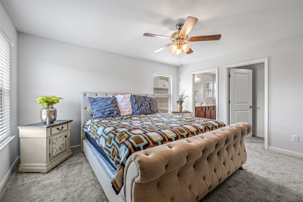 5320 Crossfield Road Memphis, TN 38109 - Photo 24 of 40 a bedroom with a bed and a chandelier