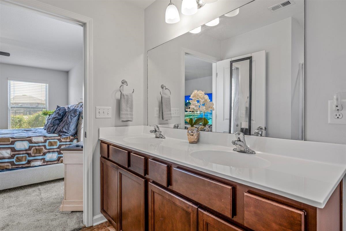 5320 Crossfield Road Memphis, TN 38109 - Photo 28 of 40 a bathroom with a sink and a mirror