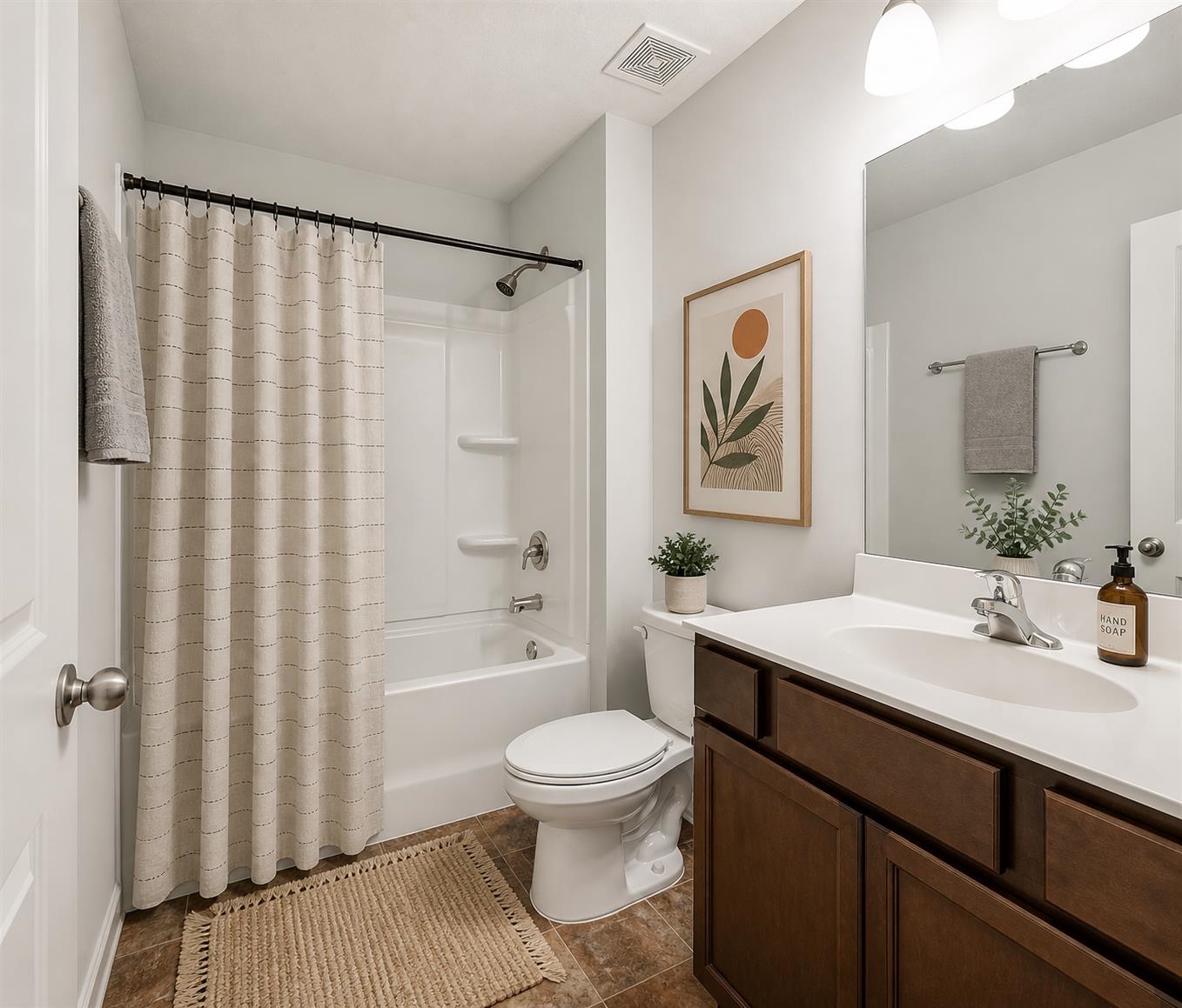 5320 Crossfield Road Memphis, TN 38109 - Photo 37 of 40 a bathroom with a sink a toilet and shower curtain