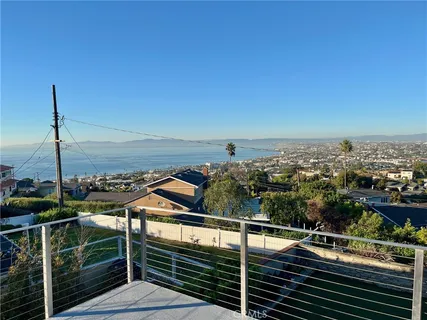 a view of a balcony with an ocean view