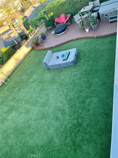 a view of a table and chairs in the grass
