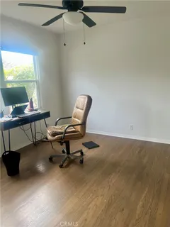 a work room with furniture and a window