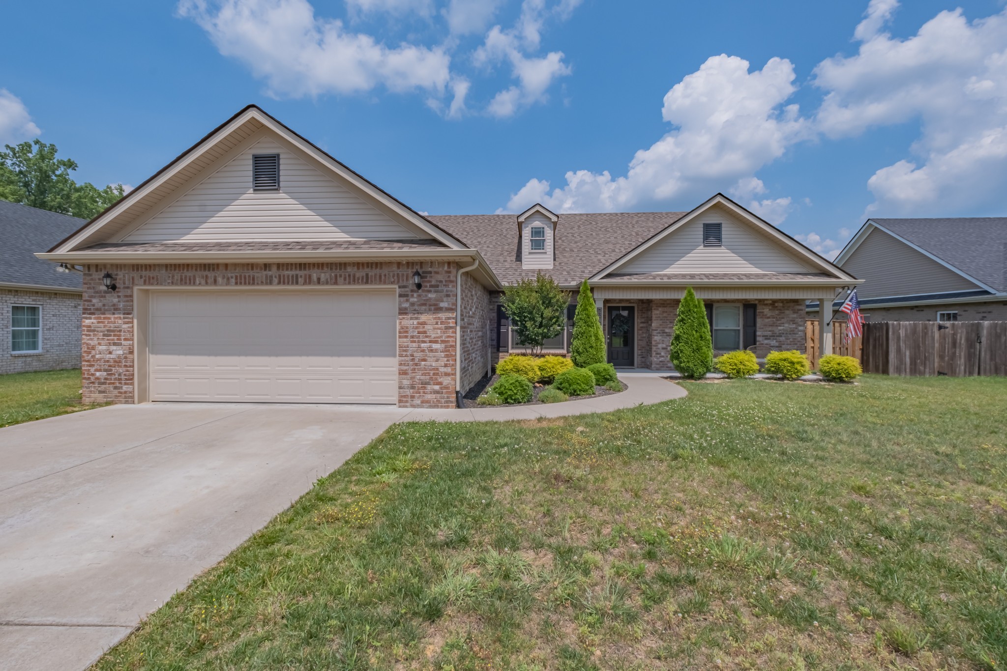 296 Spring Breeze Drive Tullahoma, TN 37388 - Photo 1 of 31 a front view of a house with garden